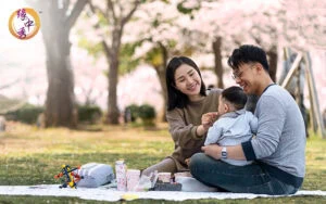 Happy family having a picnic in a public park