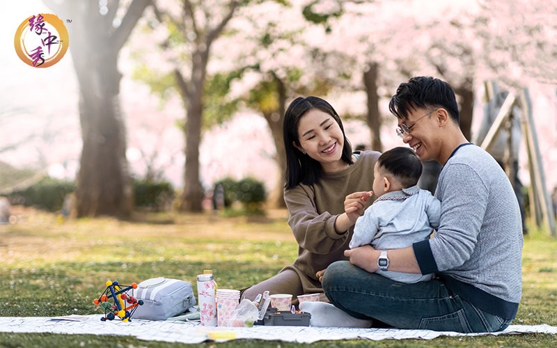 Happy family having a picnic in a public park