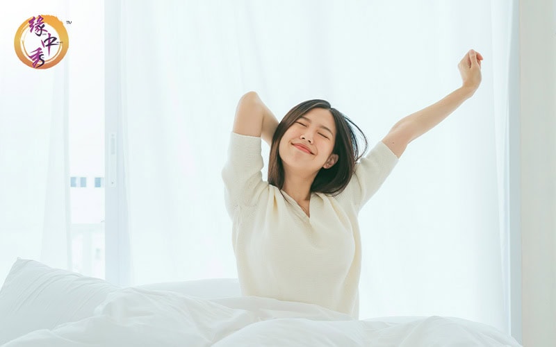 Woman waking up refreshed